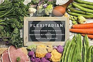 Raw vegetables, eggs and meat and text flexitarian