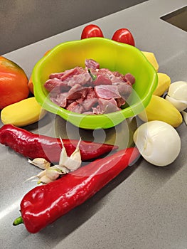 raw vegetables with meat for cooking on a cutting board