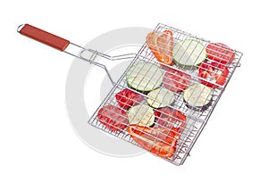 Raw vegetables prepared for grilling on a cooking grates