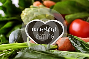 Raw vegetables and text mindful eating