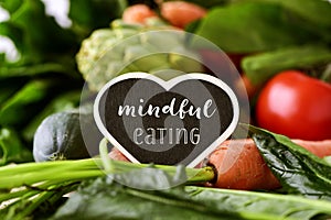 Raw vegetables and text mindful eating photo