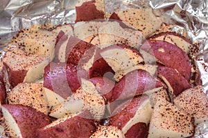 Raw Vegetables and Tofu are prepared for Kabobs on a Cutting Board