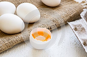 Raw white farm chicken eggs with egg yolk