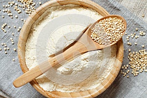 Raw white quinoa seeds and flour top view