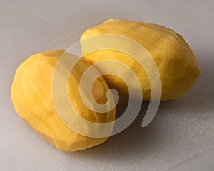 Raw whole peeled potatoes, top view, close up.