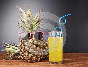 Raw whole pineapple on wooden surface table