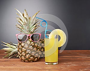 Raw whole pineapple on wooden surface table