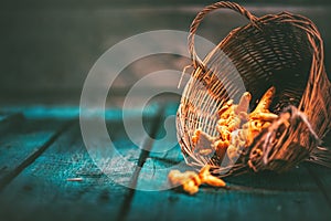 Raw wild chanterelles mushrooms in a basket