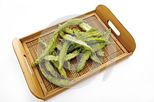 Raw winged beans (Psophocarpus tetragonolobus) on bamboo tray