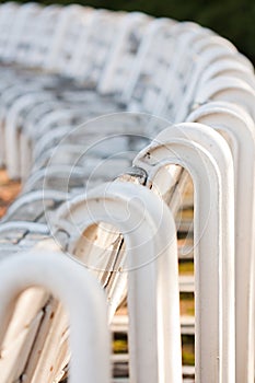 Raw of wooden chairs in the park