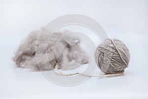 Raw wool yarn coiled into a ball