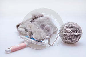 Raw wool yarn coiled into a ball