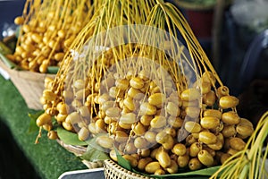 Raw yellow Dates fruit in Thai market