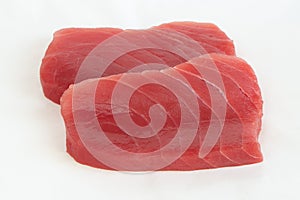 Raw yellow fin tuna Thunnus albacares fish steaks on white background