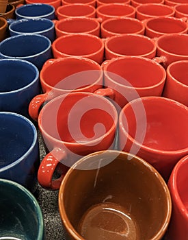 Raws of colourful cups