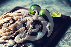 Raws prawns in a cutting board