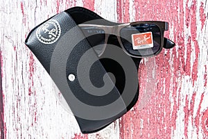 Ray Ban sunglasses and leather glasses case with brand logo