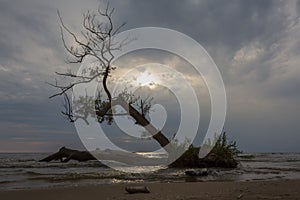 A ray of light breaks through a cloudy sky