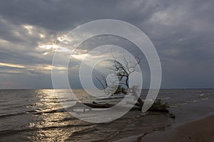 A ray of light breaks through a cloudy sky