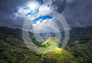 Ray of sun light through clouds. Rice terraces in Philippines