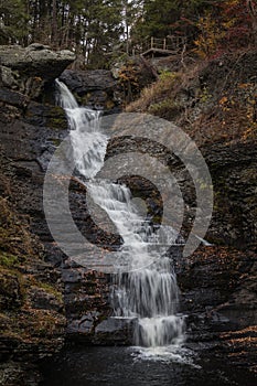 Raymondskill Falls in Autumn surrounded with brilliant fall foliage