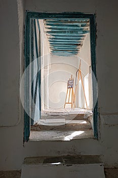 Rays of Light: Beautiful Door and Drawing Stands in an Old Building