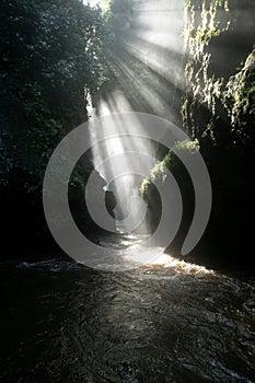 rays of light entering a river canyon