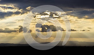 Rays of the setting sun over the Tuscan valley