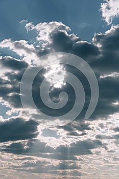 The rays of the sun are breaking through the clouds