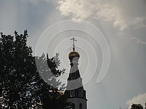 The rays of the sun illuminate the dome of the Orthodox Church