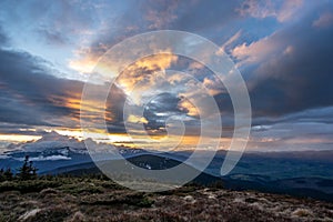 Rays of the sun at sunset in the mountains