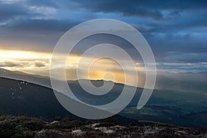Rays of the sun at sunset in the mountains