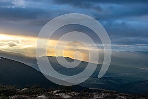 Rays of the sun at sunset in the mountains
