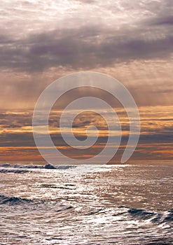 Rays of sunlight over ocean waves