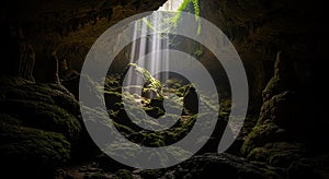 Sunbeams Illuminating a Moss- Covered Cave Interior with Stalagmites cavern underground