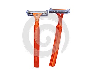 Razor in a female hand on a white background. Removal of unwanted hair. top view. Concept of using razor. Orange men`s razors