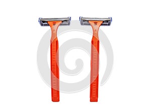 Razor in a female hand on a white background. Removal of unwanted hair. top view. Concept of using razor. Orange men`s razors