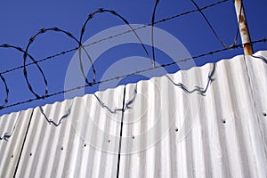 Razor wire and aluminum fence