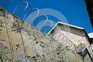 Razor wire prison wall