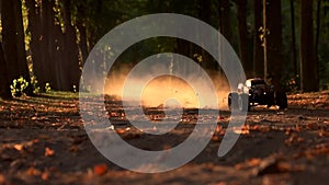 RC car drfting in a forest offroad race.