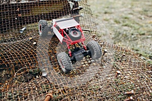 RC crawler riding rough surface og grille