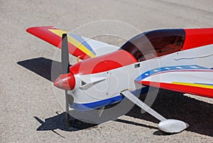 RC model airplane lands on asphalt