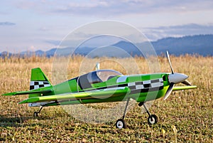 RC model green plane on runway