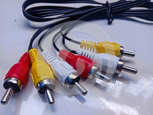 RCA cable, audio and video on white background. Yellow,red and white cable