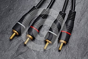 RCA connector for audio signal on black slate background