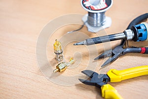 RCA jack and tool on the table,Wood background