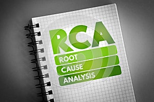 RCA - Root Cause Analysis acronym on notepad, concept background