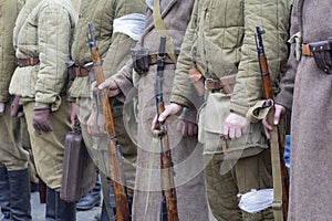 Re-enactors Dressed As Soviet Infantry Soldiers Of World War II Holds Rifles Weapons