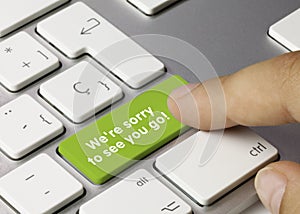 We`re sorry to see you go! - Inscription on Green Keyboard Key photo