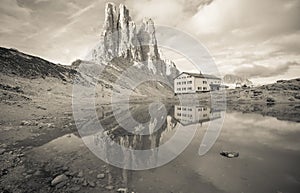 Re Umberto Primo refuge is reflecting over a little lake next to